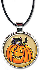 Halloween necklace or keychain features a cute black cat hiding in back of a jack-o-lantern.