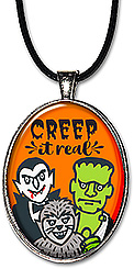 Frankenstein, Dracula & the Wolfman are featured on this handcrafted Halloween necklace or keychain with the message: Creep it real!