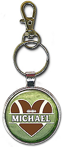 Love Football split-monogram keychain is personalized with any name in a heart-shaped football, and is also available as a pendant.