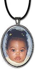 Custom Oval Photo necklace or keychain is personalized with your photo. A name or date can be added.