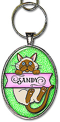 This siamese cat monogram jewelry, is personalized with any initial, and is available as a necklace or keychain.